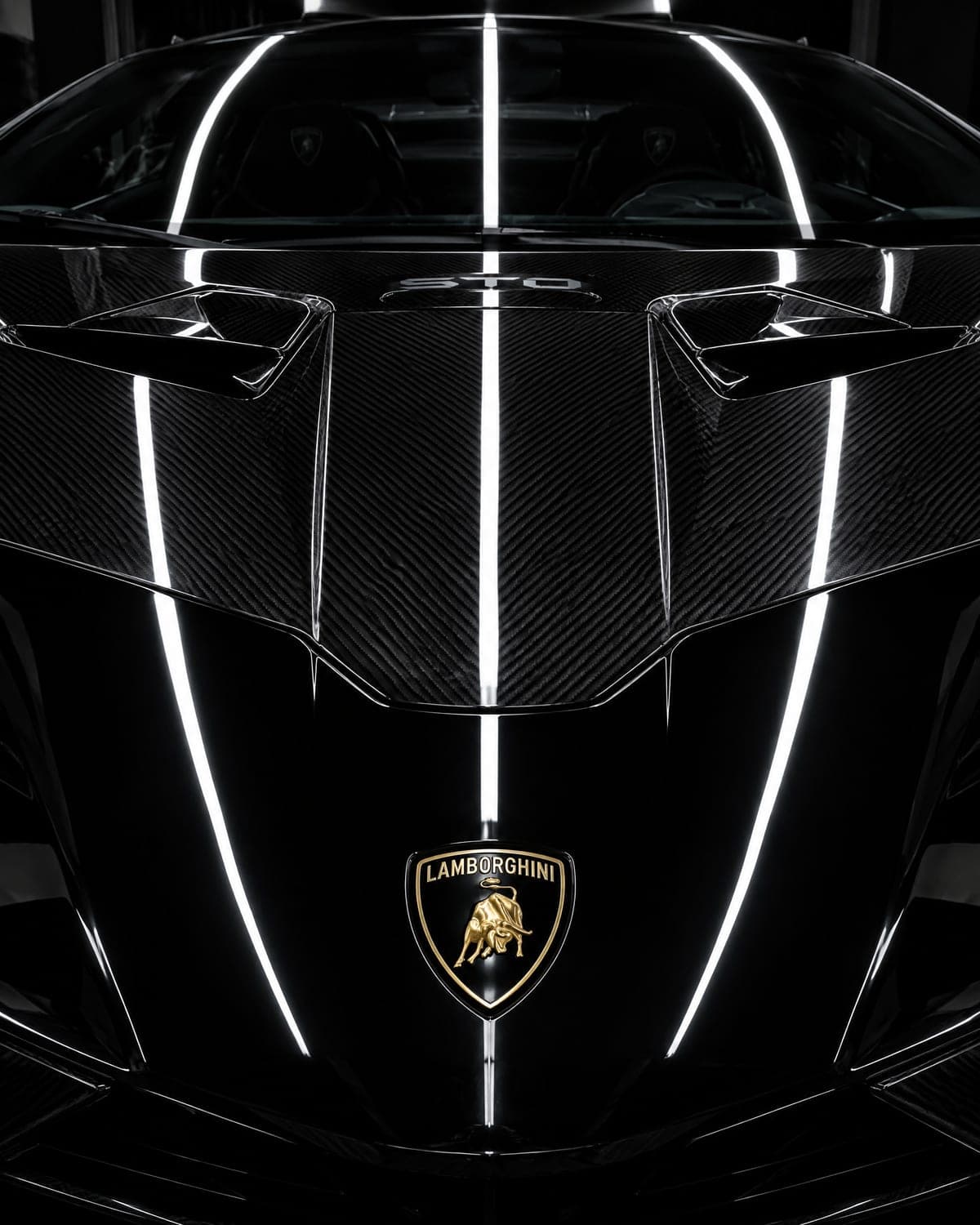 Glossy Lamborghini hood reflecting studio light strips